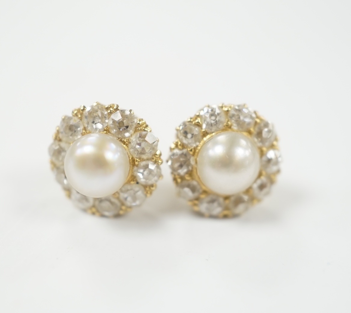 A pair of yellow metal (stamped 18), cultured pearl and diamond cluster set flower head ear studs, diameter 9mm, gross weight 2.9 grams.